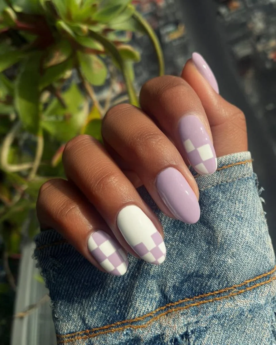 Neon peach nails with miniature heart decals for a playful nail art design.