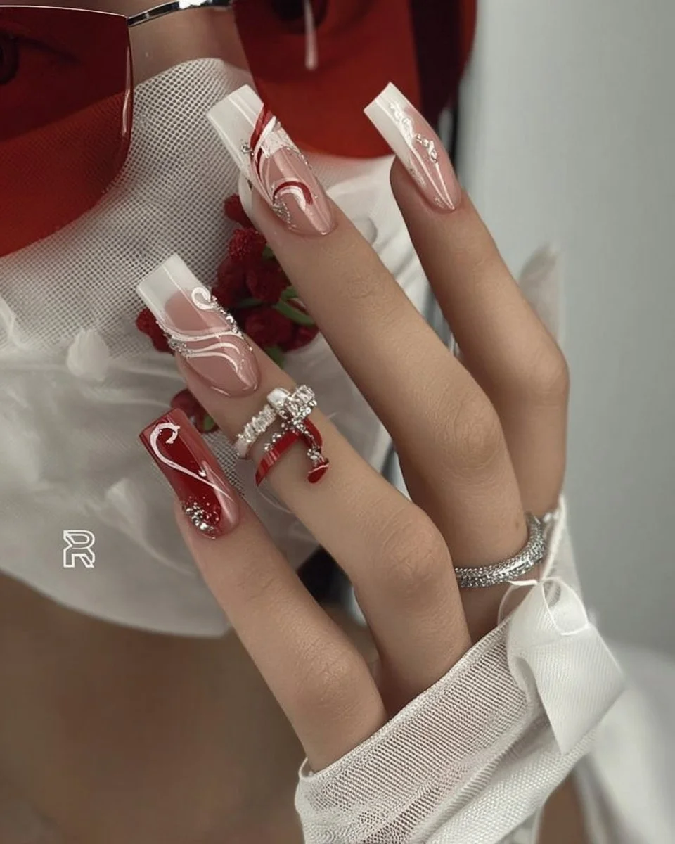 Romantic red and white nail art design with lips and rhinestones