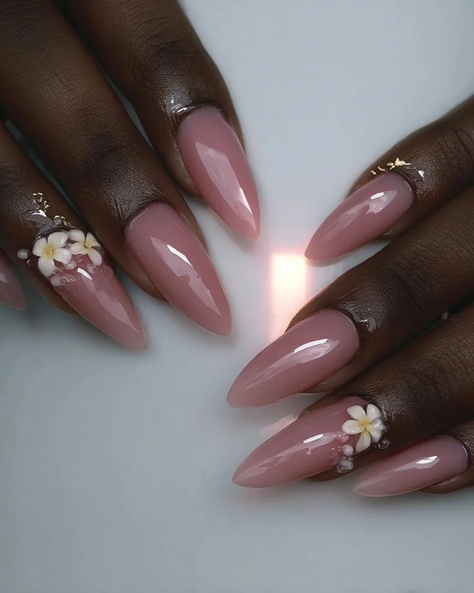 Beautiful pink floral nails design showcasing intricate floral patterns