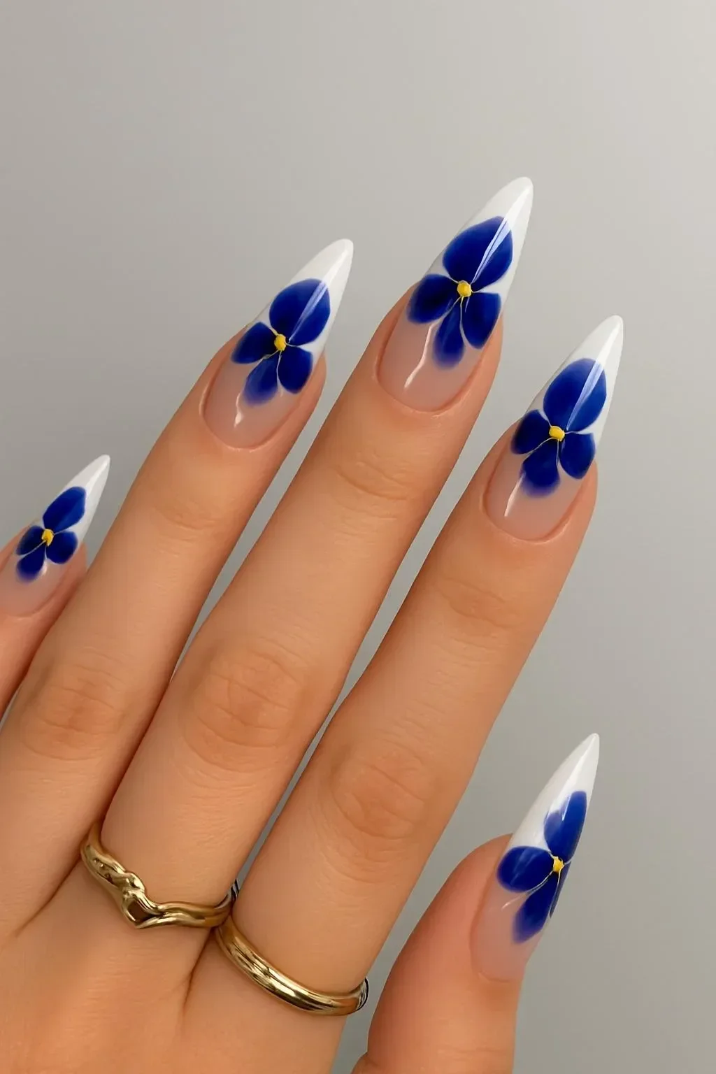 Collection of beautiful blue and white nail designs showcasing unique patterns and styles.