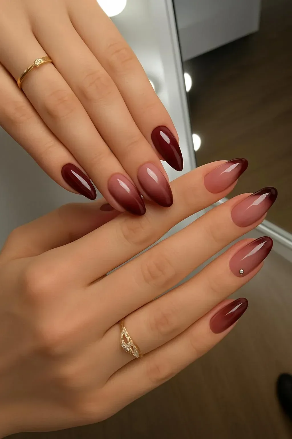 Moody red French tip manicure with Black Cherry Aura Nails and silver gems