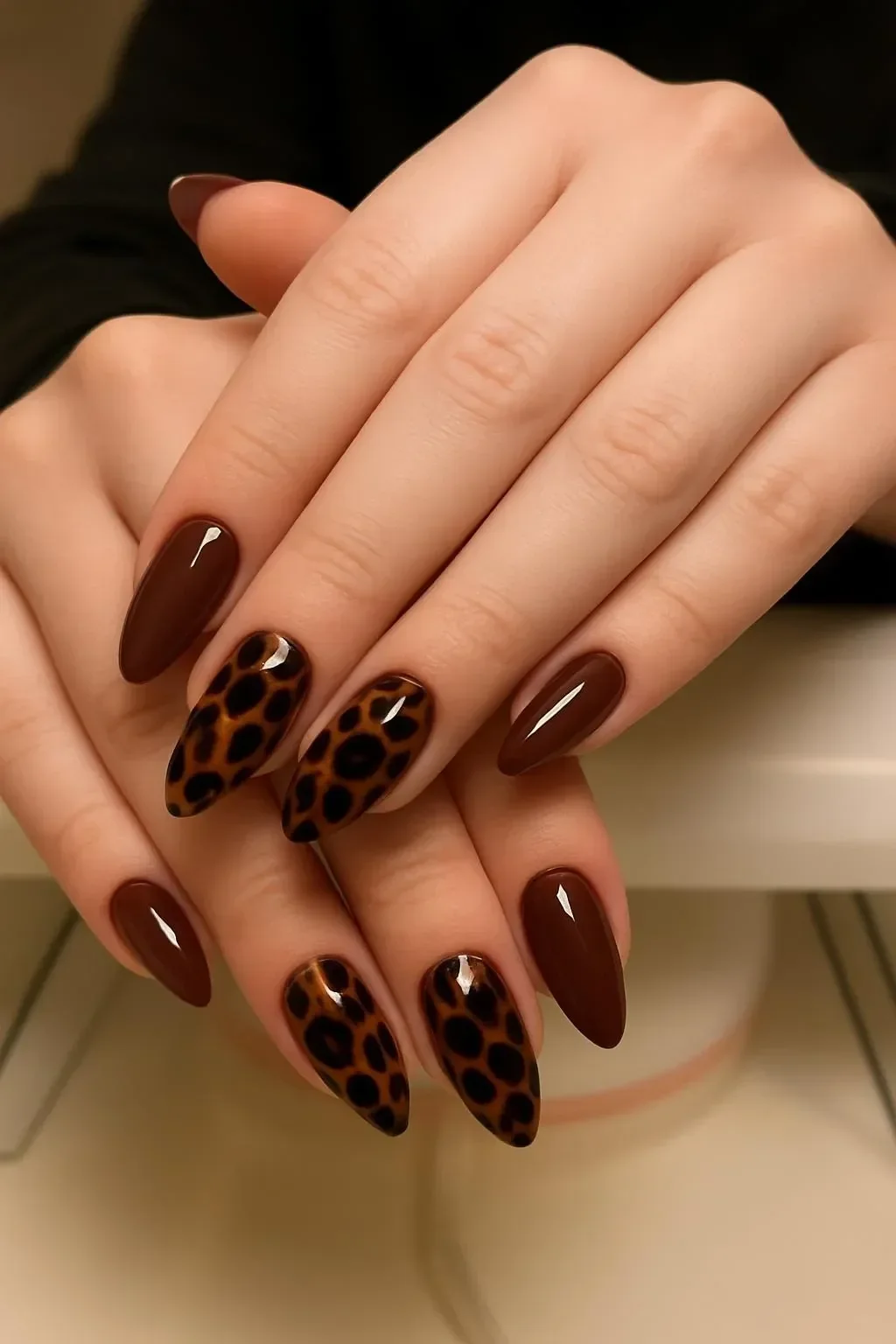 Stylish Brown Leopard Almond Nails design with a trendy leopard print pattern.