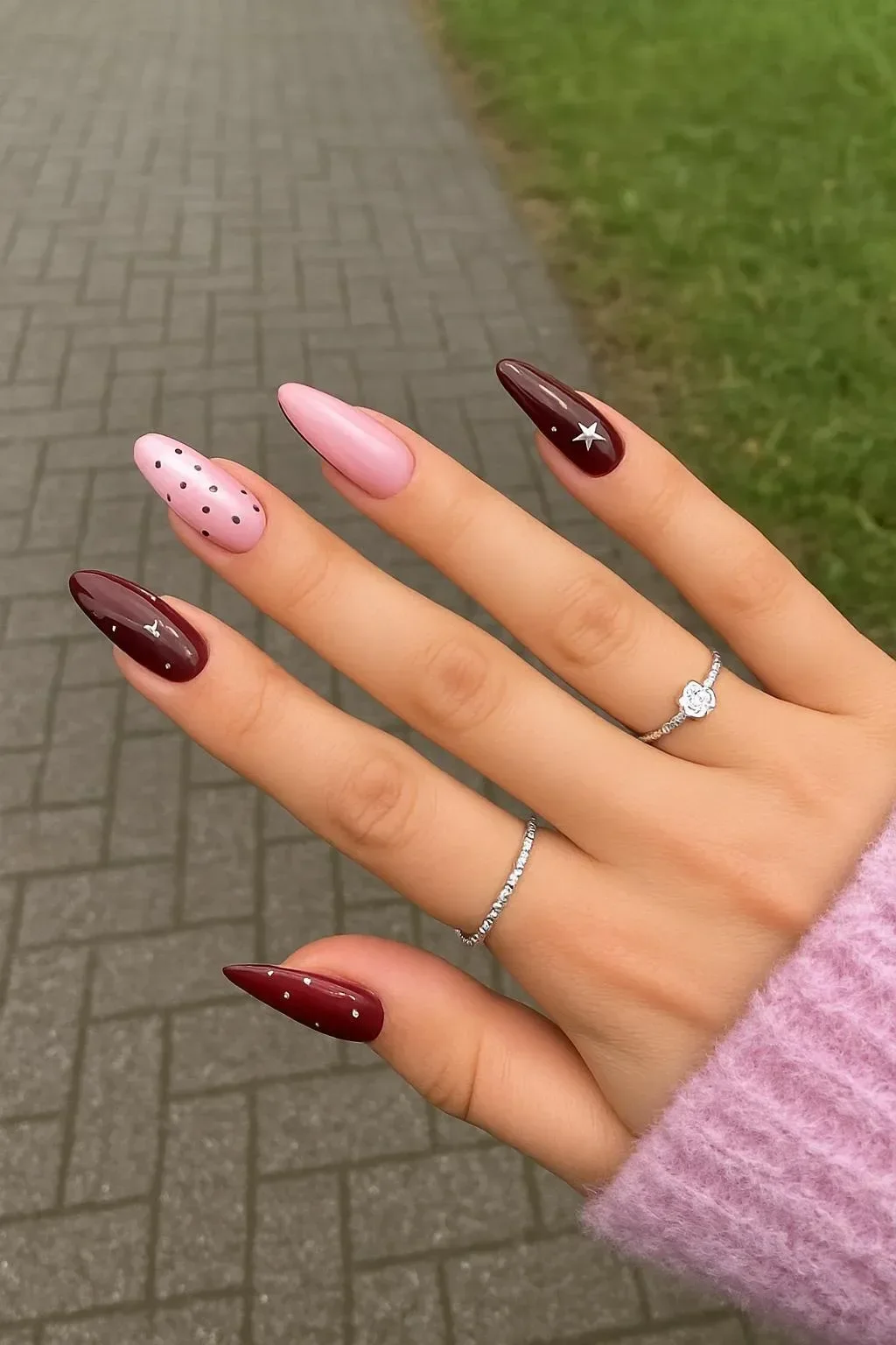 Burgundy and lavender starry night nails with polka dot and star almond design