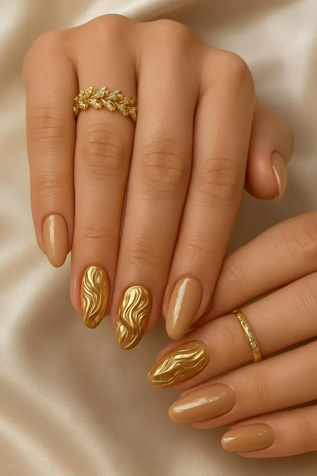 Stunning nude and gold chrome abstract swirl nails design