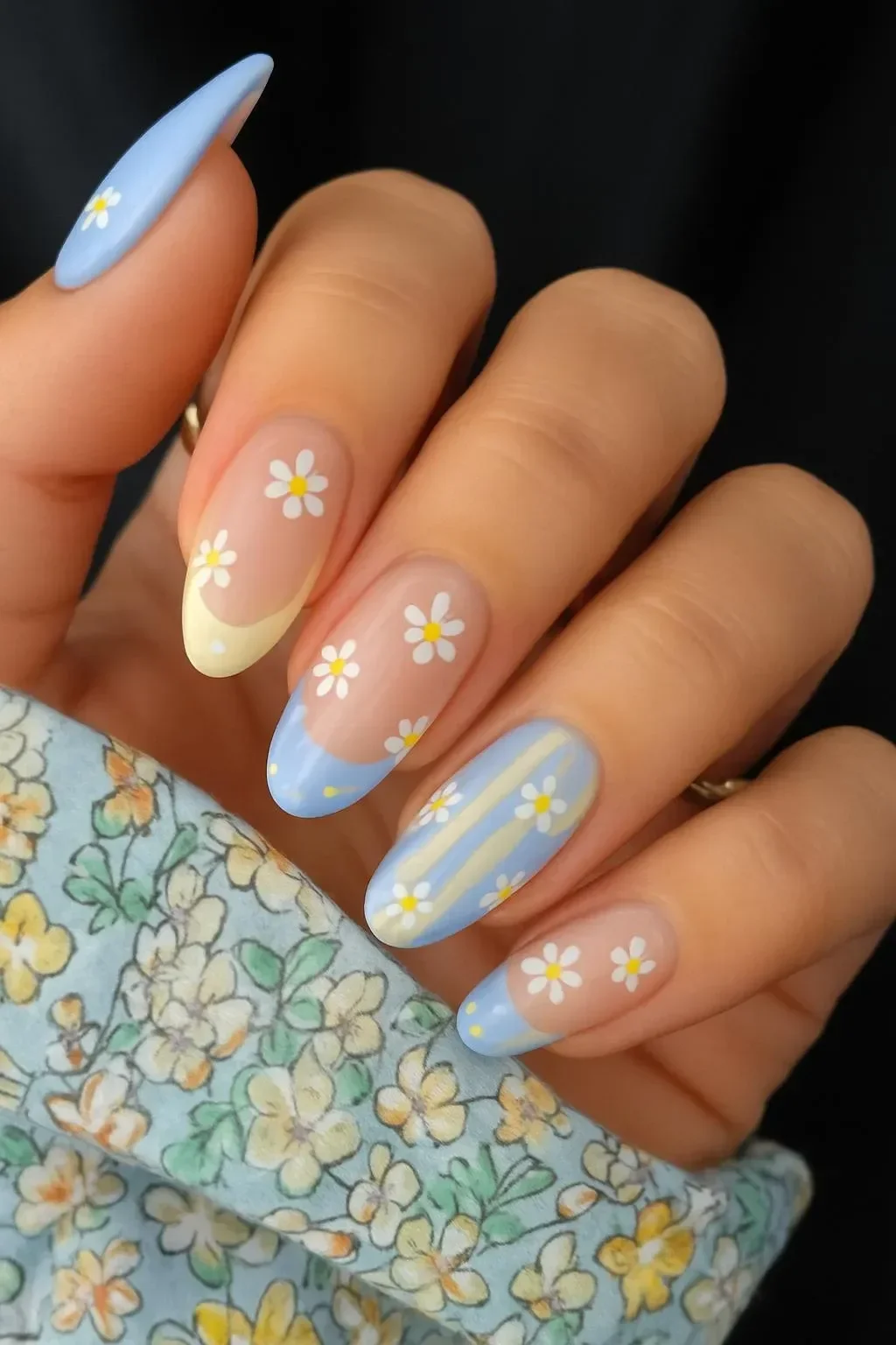 Spring pastel nails featuring various creative designs and color combinations.