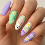 Beautiful floral Easter nail design featuring vibrant spring colors.
