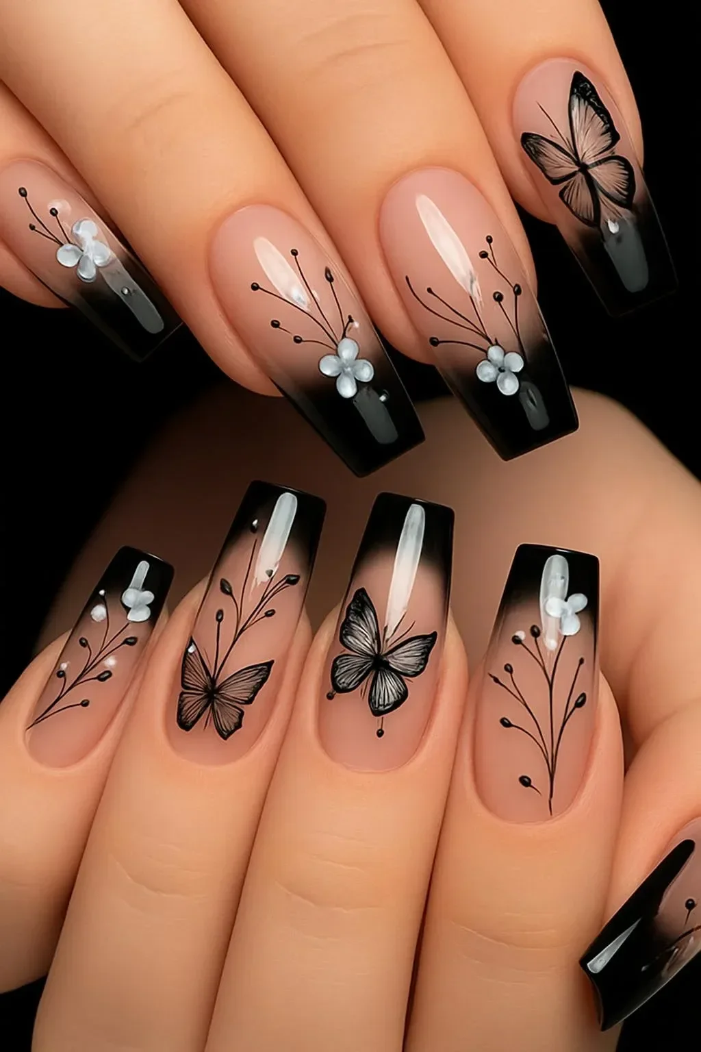 Trendy black nail designs showcased in a beautiful art display.