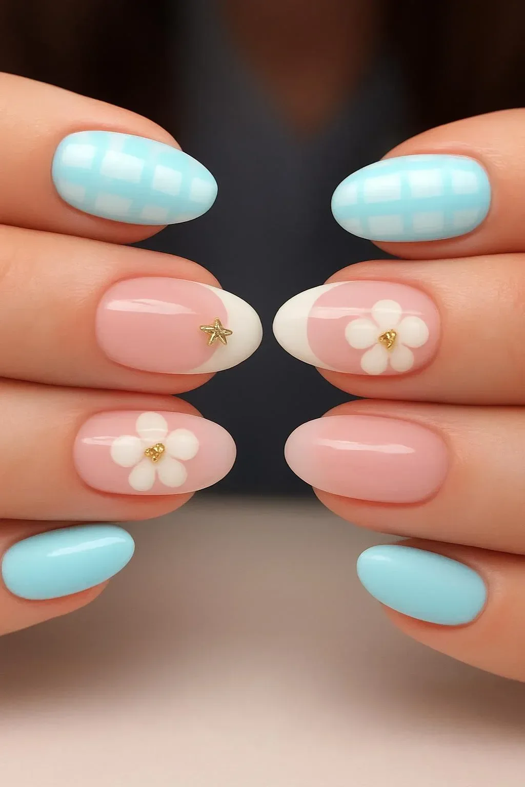 Blue and white French nails with flower designs and gold stars on press-on nails