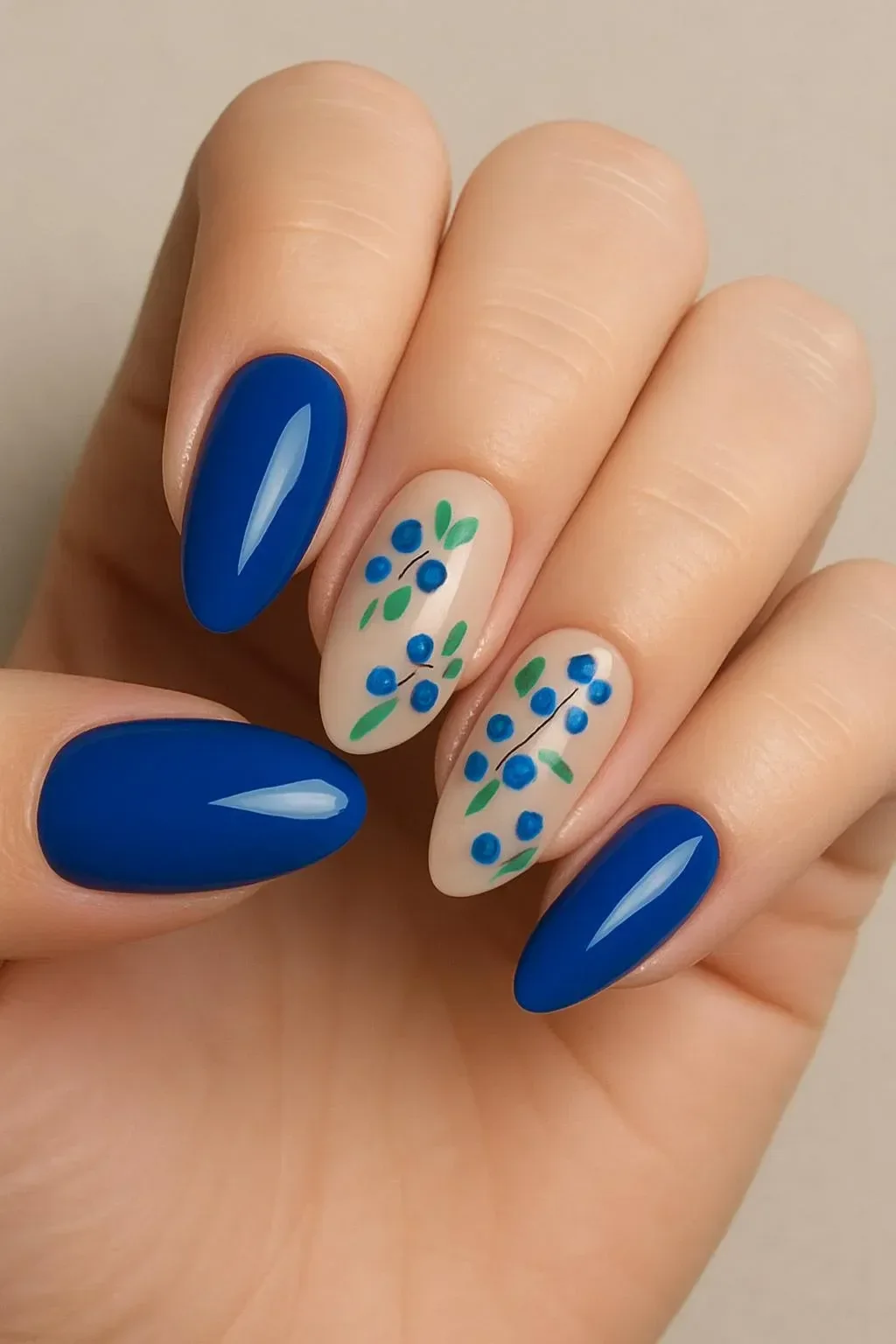 Beautiful blueberry nails showcasing a trendy nail art design with blue hues.