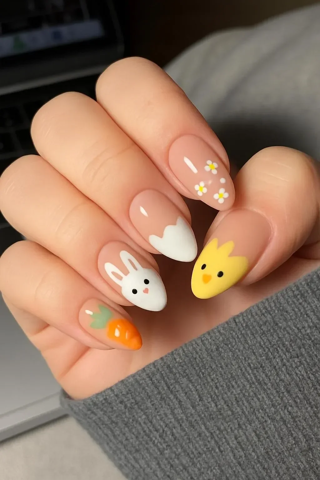 Colorful Easter nails with bunny and carrot designs for spring celebrations