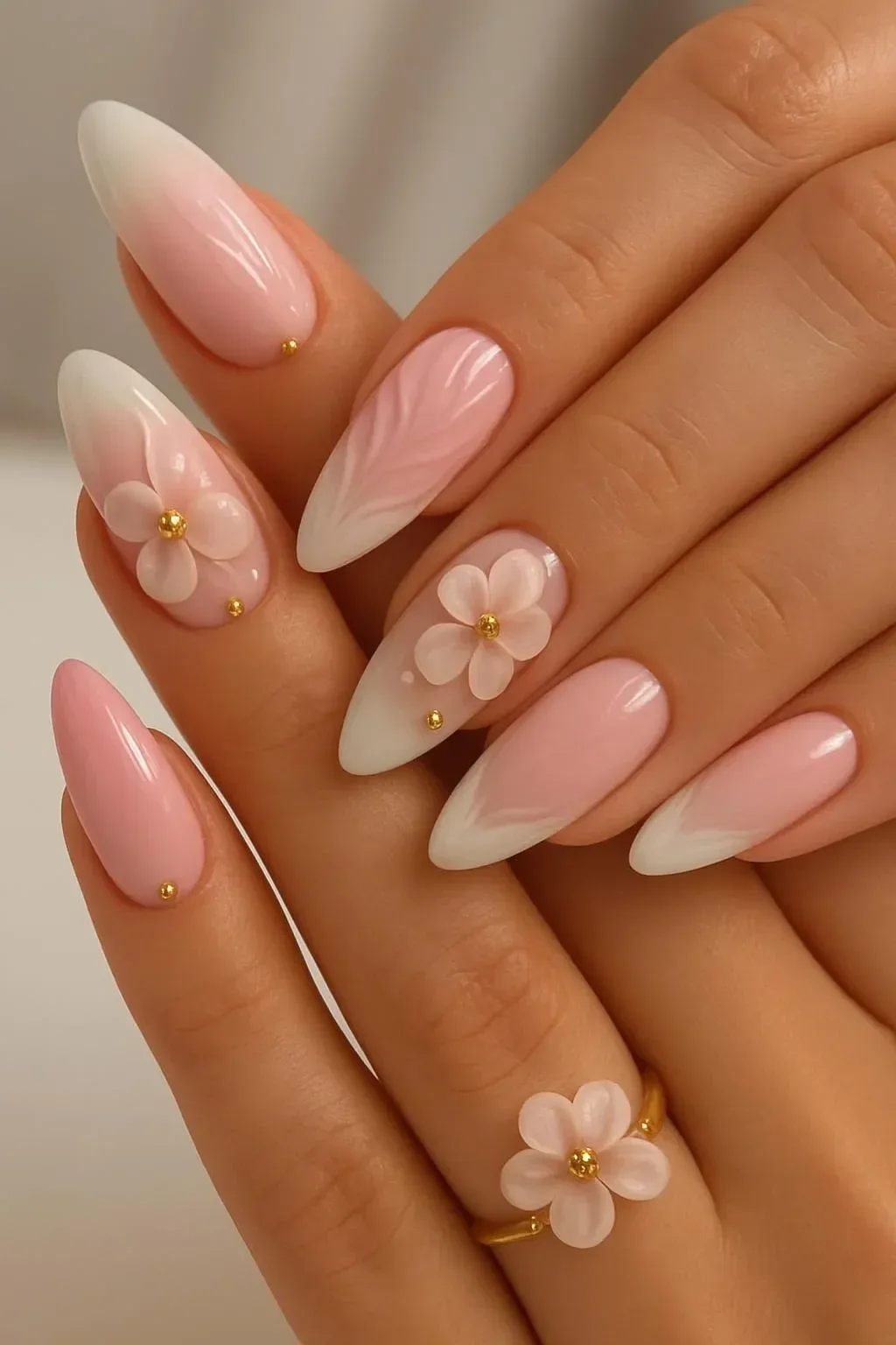 Elegant 3D floral French nails in pink and white almond shape design
