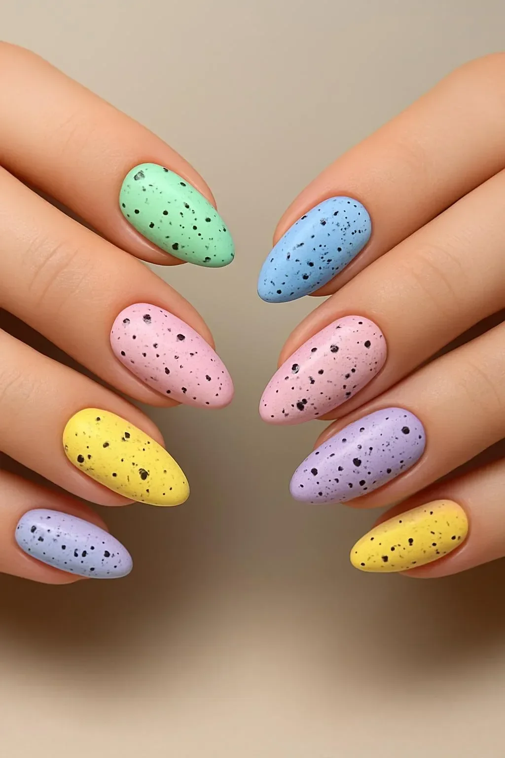 Beautiful speckled nail designs for spring featuring vibrant colors and patterns.