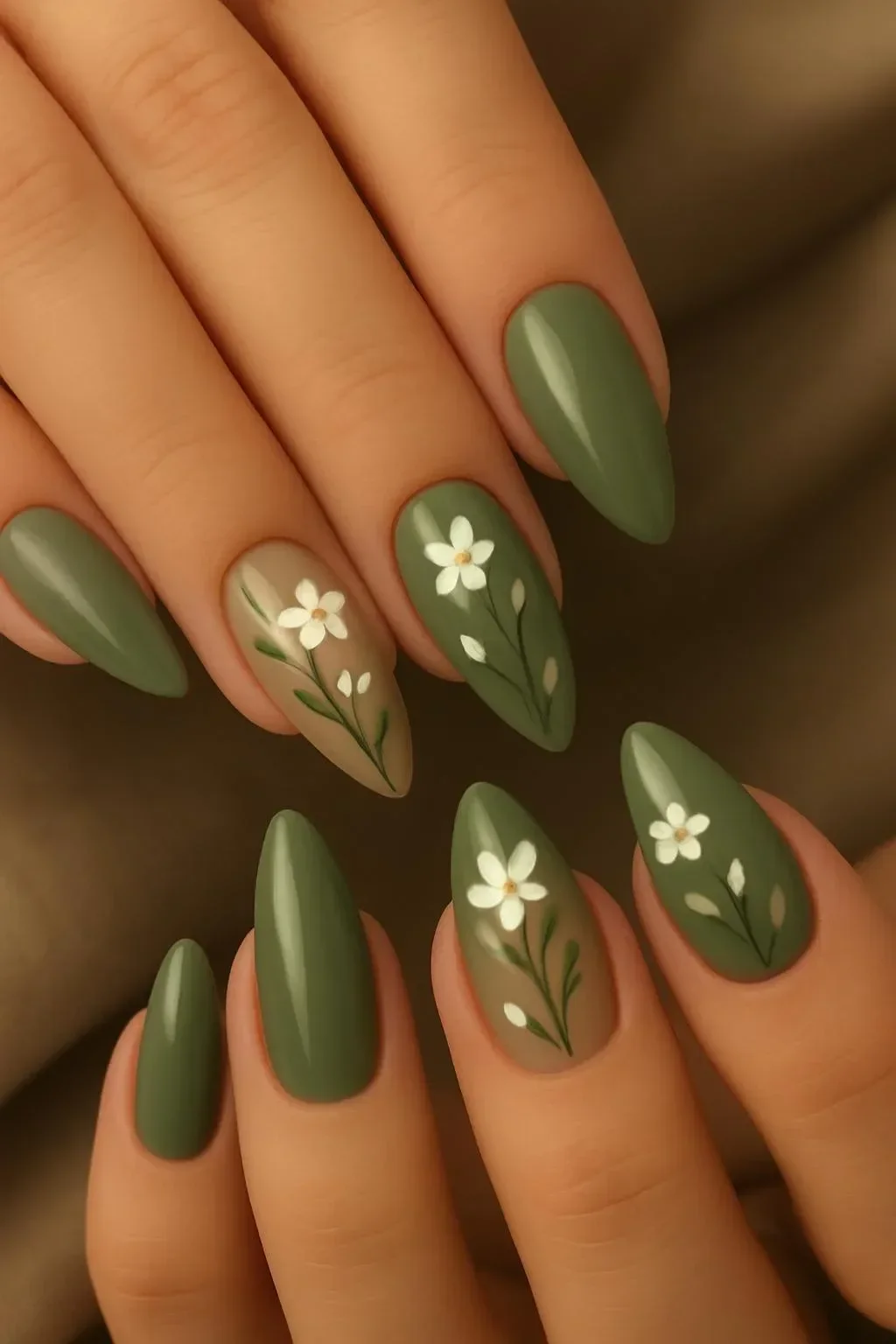 Beautiful green nails with floral designs featuring natural aesthetics.