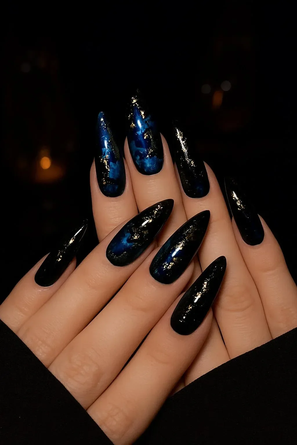 Luxury deep blue cat-eye press-on nails with gold celestial designs