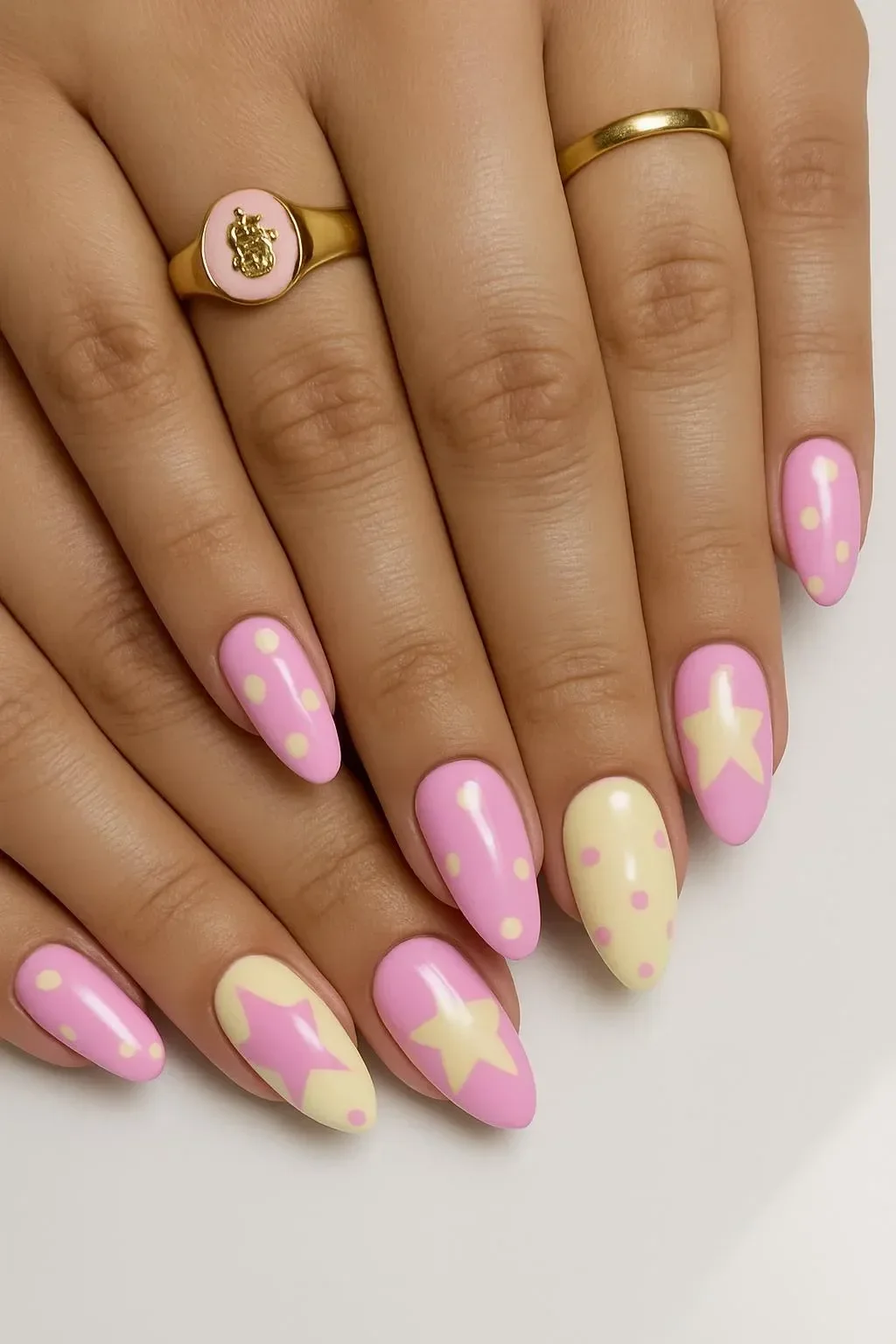 Creative nail art showcasing almond shapes, two-color designs, and neutral fun styles.