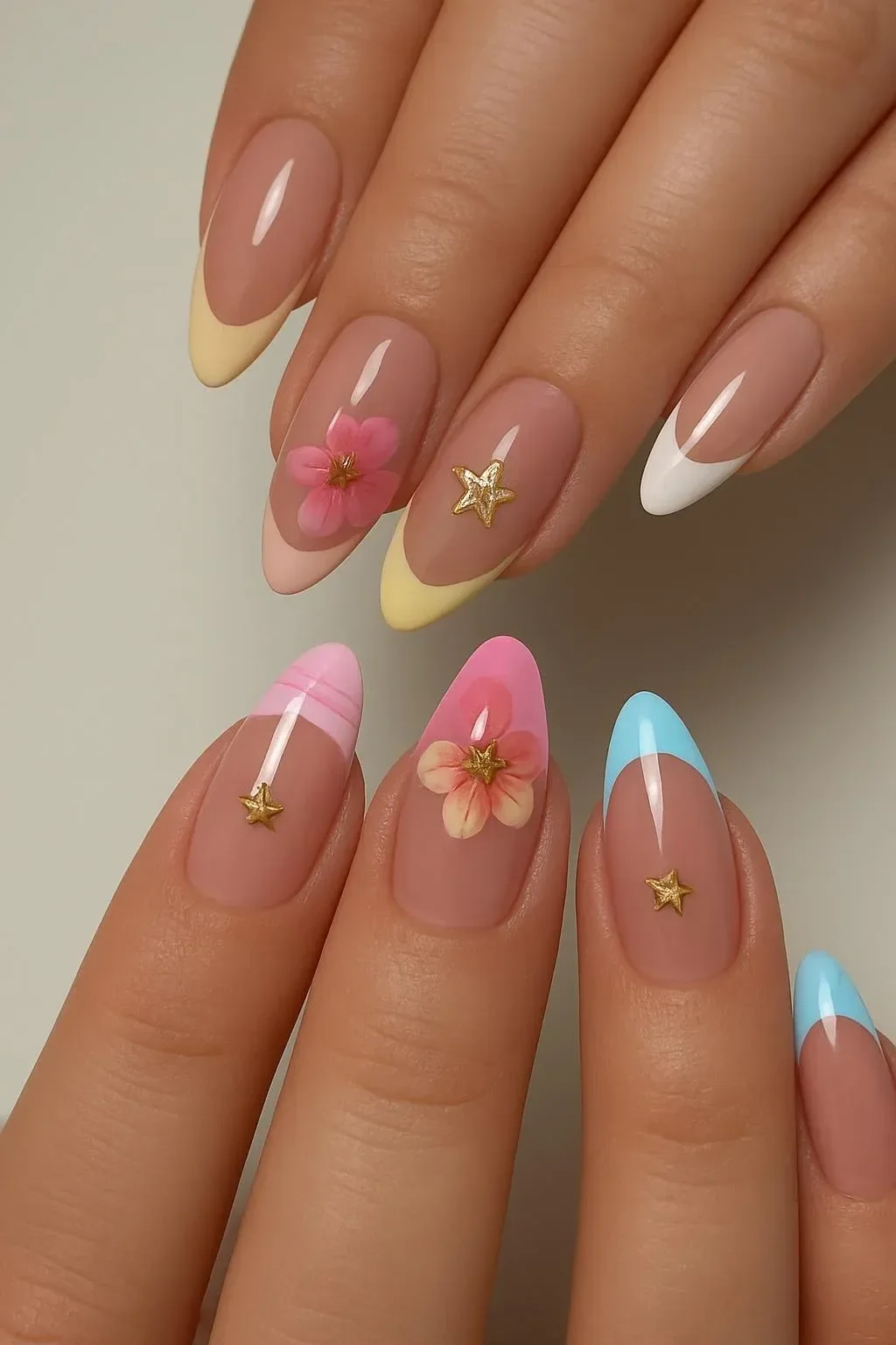 Girly acrylic nails featuring vibrant spring and summer designs