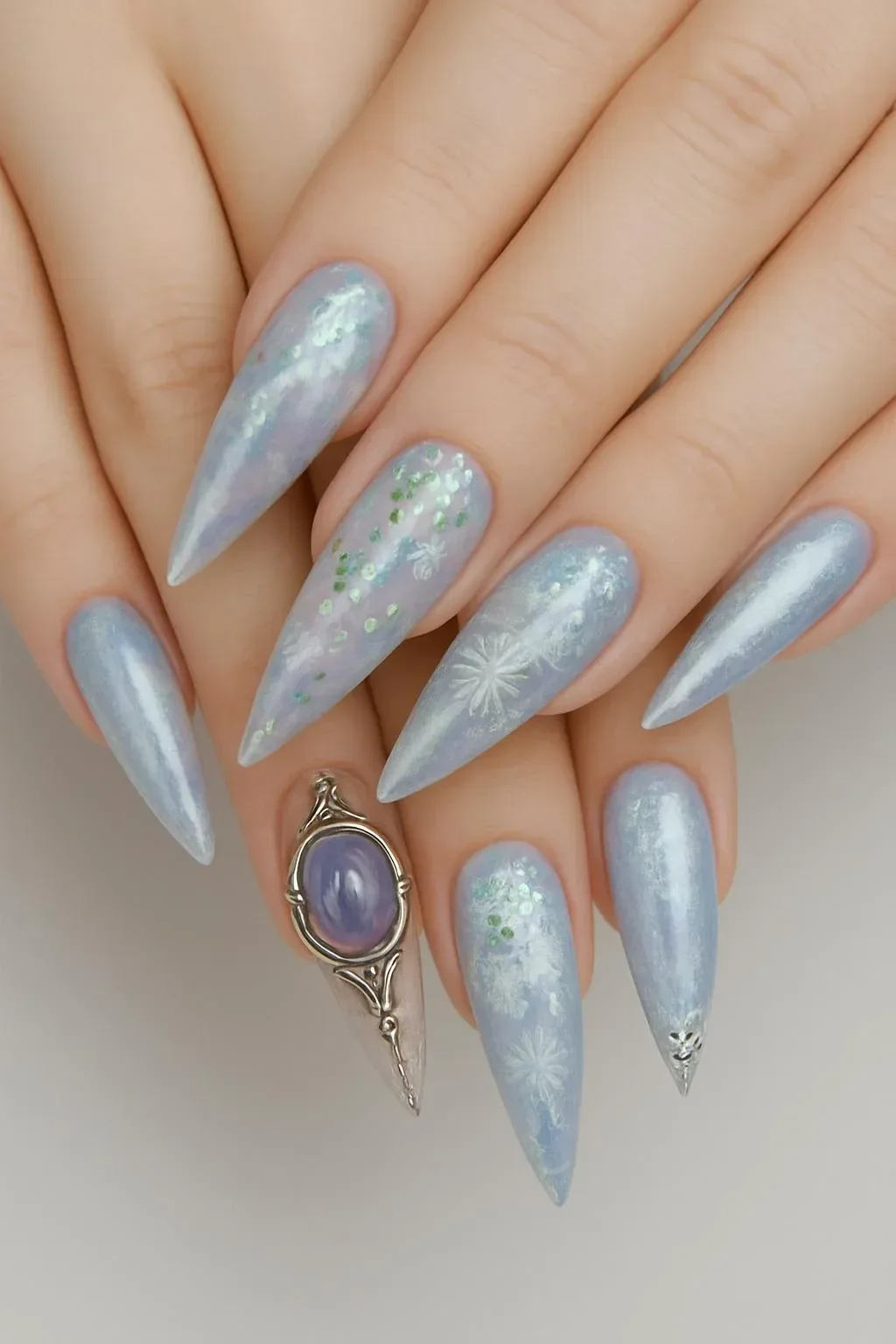 Elegant expensive nails featuring soft chrome and intricate details that shine.