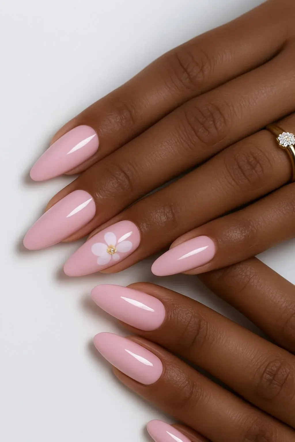 Trendy pink floral nails showcasing various designs for a stylish manicure.