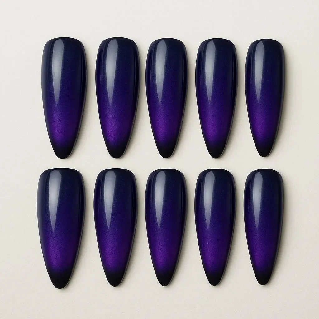 Purple-blue cat eye nails with a shifting effect, resembling galaxy energy.