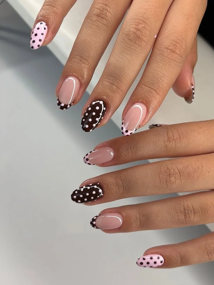 Trendy polka dot nails in various designs and colors.