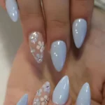 Elegant blue floral nails designs showcasing a trendy manicure style.