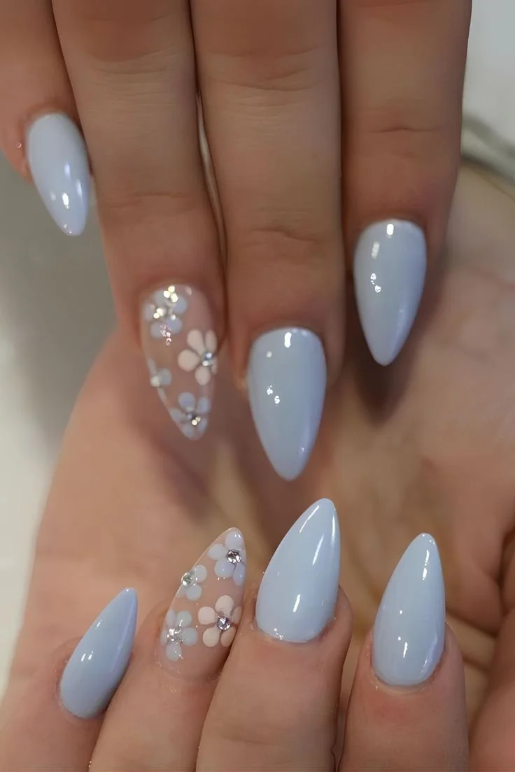 Elegant blue floral nails designs showcasing a trendy manicure style.