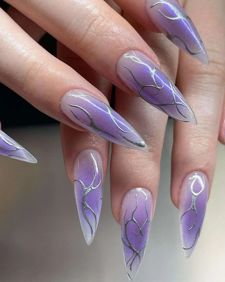 Stunning lavender chrome nails gleaming in the sunlight for summer